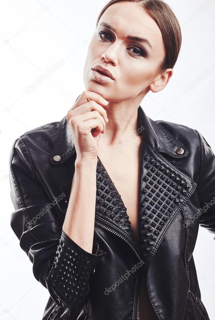 Fashion style girl portrait. Beautiful fashion woman with professional styling, hairdress and makeup. model released