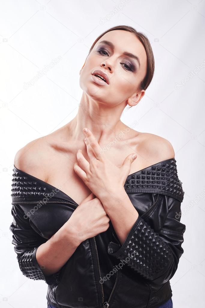 Fashion style girl portrait. Beautiful fashion woman with professional styling, hairdress and makeup. model released