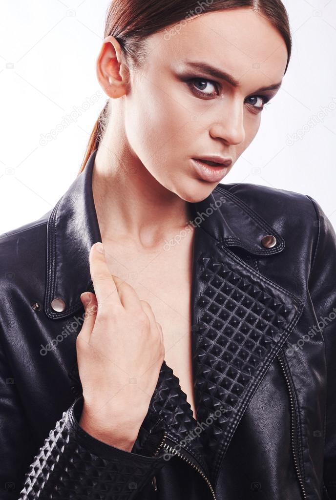 Fashion style girl portrait. Beautiful fashion woman with professional styling, hairdress and makeup. model released
