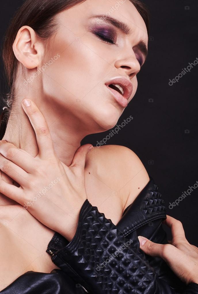 Fashion style girl portrait. Beautiful fashion woman with professional styling, hairdress and makeup. model released