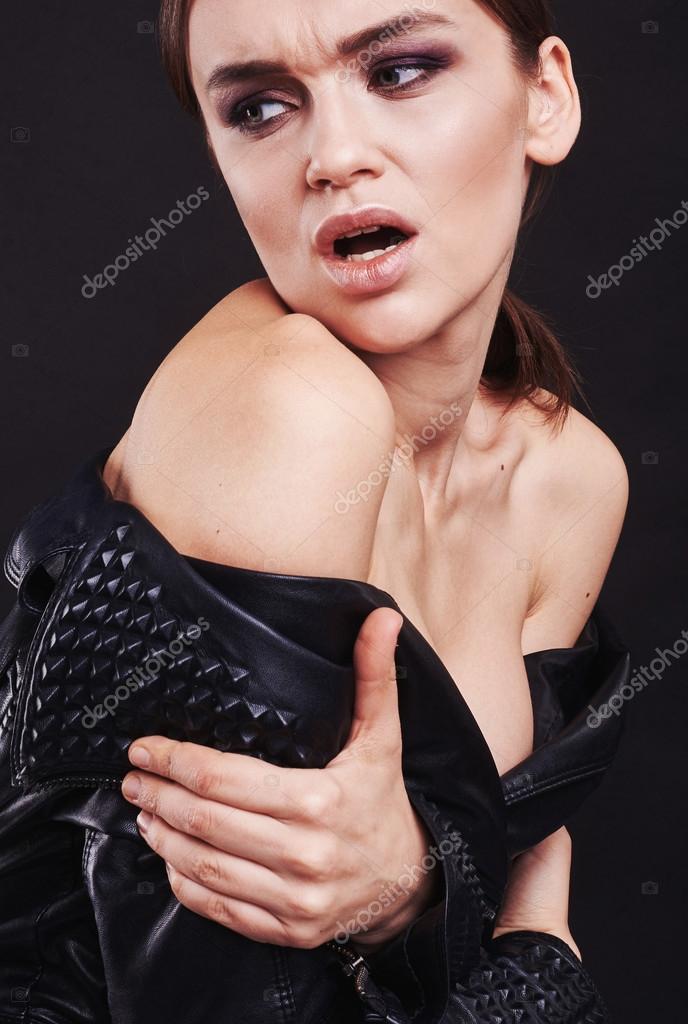 Fashion style girl portrait. Beautiful fashion woman with professional styling, hairdress and makeup. model released