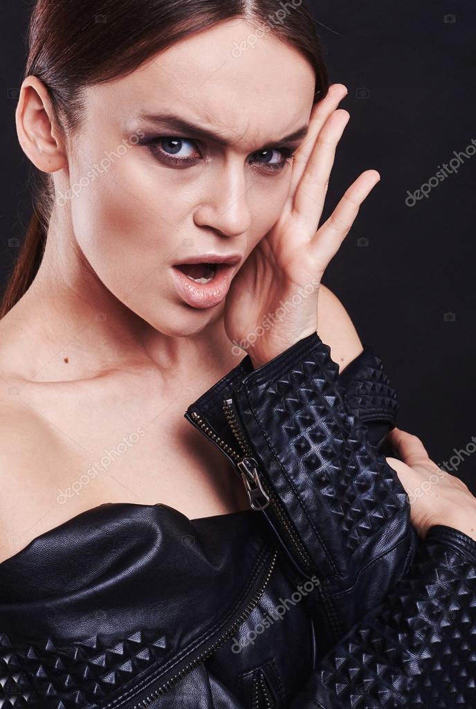 Fashion style girl portrait. Beautiful fashion woman with professional styling, hairdress and makeup. model released