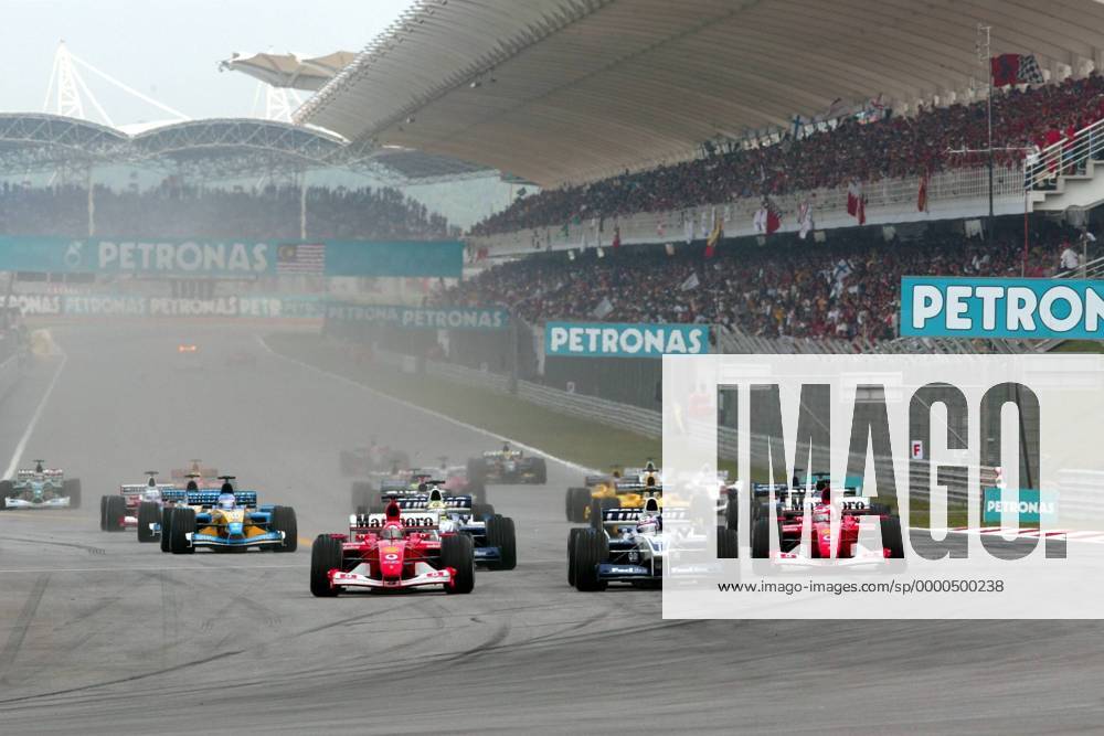 Startsituation Malaysia, v.li.: Michael Schumacher (Deutschland Ferrari), Juan-Pablo Montoya (Kolumbien BMW-Williams), Rubens Barrichello (Brasilien Ferrari) Motorsport Grand Prix Herren Großer Preis von Malaysia 2002, Formel 1 Weltmeisterschaft, F1, F, GP, WM, Vdig Totale International Circuit Kuala Lumpur Sepang