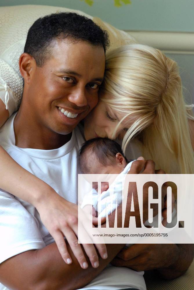 Jun 27, 2007 - Miami, FL, USA - TIGER WOODS (L) and ELIN WOODS with their new daughter, SAM ALEXIS WOODS - at a private residence in Florida on June 23, 2007. The world s top-ranked golfer became a father for the first time, one day after tying for second at the US Open. His wife, Swedish model Elin Nordegren, gave birth to the girl, named Sam Alexis Woods. Now, Tiger Woods new-born daughter has appeared in front of the cameras for the first time, and Woods has released photos on his website. PICTURED: Tiger Woods and Elin Woods with their daughter, Sam Alexis Woods. - ZUMAz03 o0 USA
