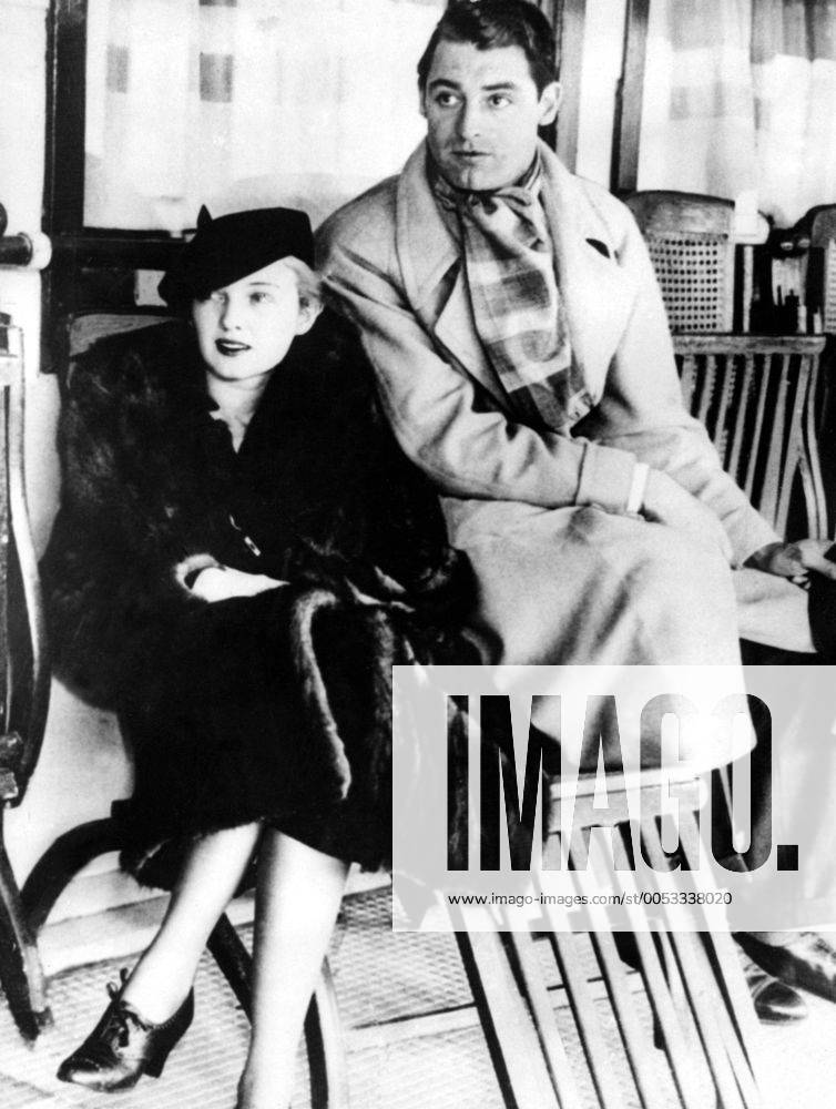 Nov 23, 1933 - Los Angeles, CA, USA - British-born actor CARY GRANT (born Archibald Leach) with his future wife VIRGINIA CHERRILL before leaving to England. Grant escaped his humble Bristol environs and unstable home life by joining an acrobatic troupe, where he became a stilt-walker. Numerous odd jobs kept him going until he tried acting, and, after moving to the United States, he managed to lose his accent, developing a clipped mid-Atlantic speaking style uniquely his own. He was noted as perhaps the foremost exemplar of the debonair leading man, handsome, witty and charming. He was named the second Greatest Male Star of All Time of American cinema by the American Film Institute. Los Angeles USA - ZUMAk09