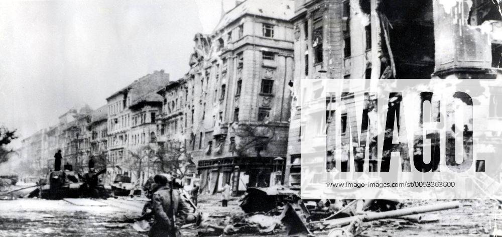 Oct 31, 1956 - Budapest, Hungary - The Hungarian Revolution of 1956 was a spontaneous nationwide revolt against the Stalinist government of Hungary and its Soviet-imposed policies, lasting from 23 October until 10 November 1956. It began as a student demonstration which attracted thousands as it marched through central Budapest to the Parliament building. After the revolt spread quickly across Hungary, and the government fell, thousands organized into militias, battling the State Security Police and Soviet troops. On 4 November, a large Soviet force invaded Budapest. By January 1957, the new Soviet-installed government had suppressed all public opposition. PICTURED: Panorama of Baross Street - ruins and destroyed soviet tanks. Budapest Hungary - ZUMAk09