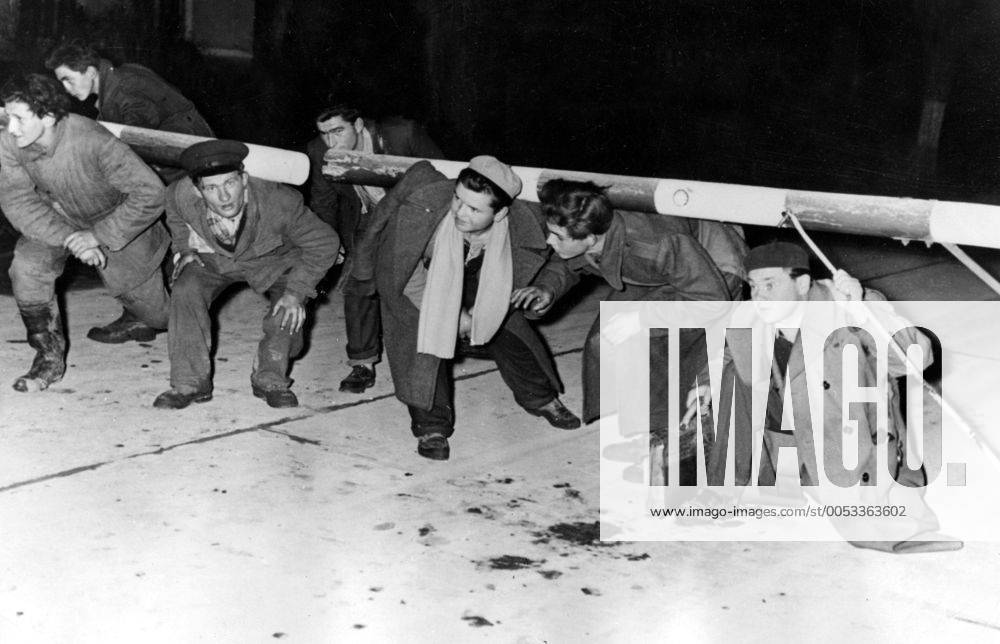 Nov 01, 1956 - Budapest, Hungary - The Hungarian Revolution of 1956 was a spontaneous nationwide revolt against the Stalinist government of Hungary and its Soviet-imposed policies, lasting from 23 October until 10 November 1956. It began as a student demonstration which attracted thousands as it marched through central Budapest to the Parliament building. After the revolt spread quickly across Hungary, and the government fell, thousands organized into militias, battling the State Security Police and Soviet troops. On 4 November, a large Soviet force invaded Budapest. By January 1957, the new Soviet-installed government had suppressed all public opposition. PICTURED: Hungarian refugees fleeing into Austria. Budapest Hungary - ZUMAk09