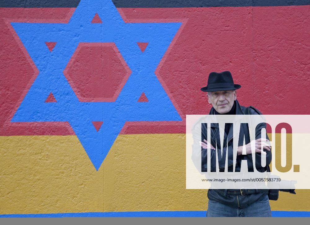 Artist Günther Schäfer stands in front of a segment of the original Berlin wall in Berlin on November 6, 2009. Schaefer painted this segment of the wall in 1990 after the fall of then East Germany and, as part of a ceremony commemorating the 20th anniversary of the fall, recently restored his work. This site, located at the East Side Gallery, is the longest, best kept segment of the original wall. UPI Photo David Silpa BER20091106701