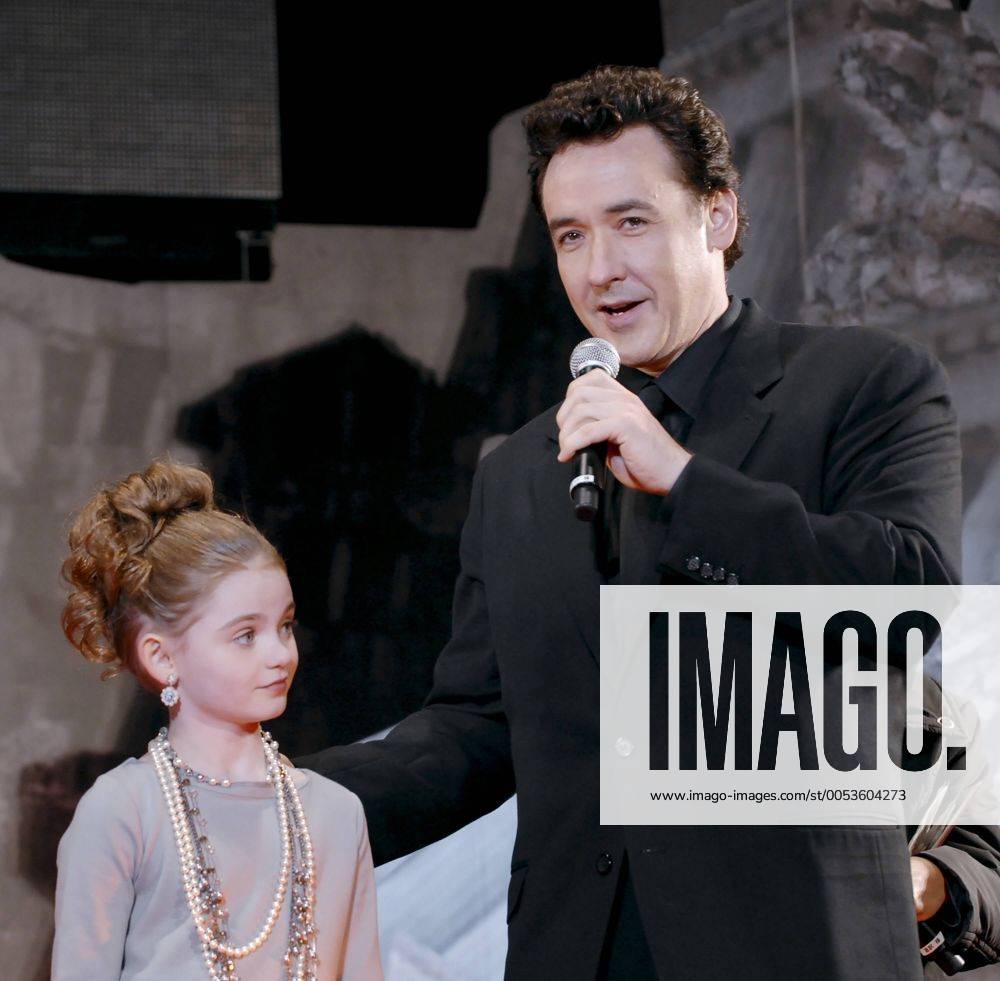 Actress Morgan Lily (L) and actor John Cusack attend a Japan premiere for the film 2012 at Tokyo, Japan, on November 17, 2009. TKP2009111724