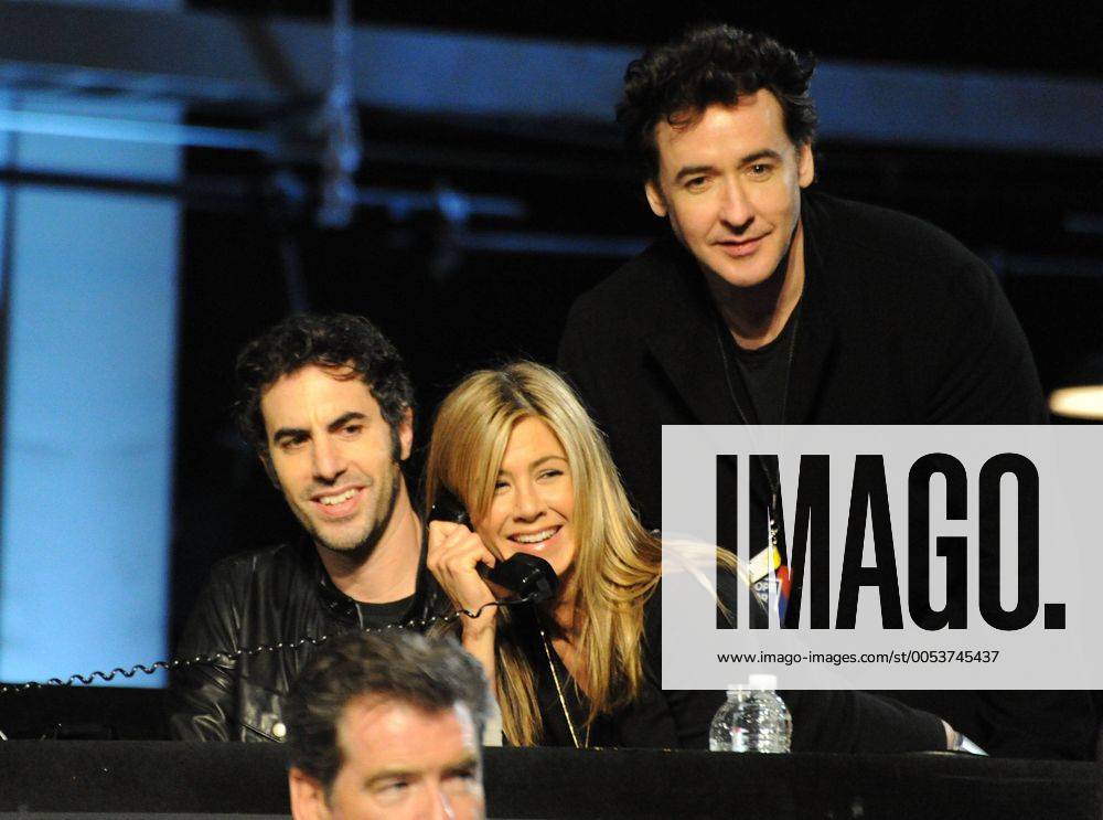 In this handout photo provided by MTV, actors Sacha Baron Cohen, Jennifer Aniston and John Cusack (L-R) gather at the Hope For Haiti Now: A Global Benefit For Earthquake Relief telethon on January 22, 2010 in Los Angeles. LAP2010012235