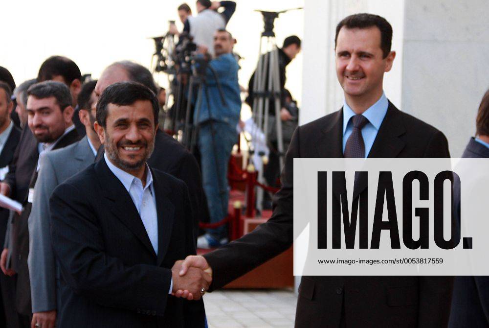 (100225) -- DAMASCUS, Feb. 25, 2010 (Xinhua) -- Syrian President Bashar al-Assad (R) greets his Iranian counterpart Mahmoud Ahmadinejad at the Al-Shaab presidential palace in Damascus on Feb. 25, 2010. Iran s President Mahmoud Ahmadinejad started his two-day visit to Damascus on Thursday. (Xinhua Bassim) (yy) (2)SYRIA-IRAN-VISIT