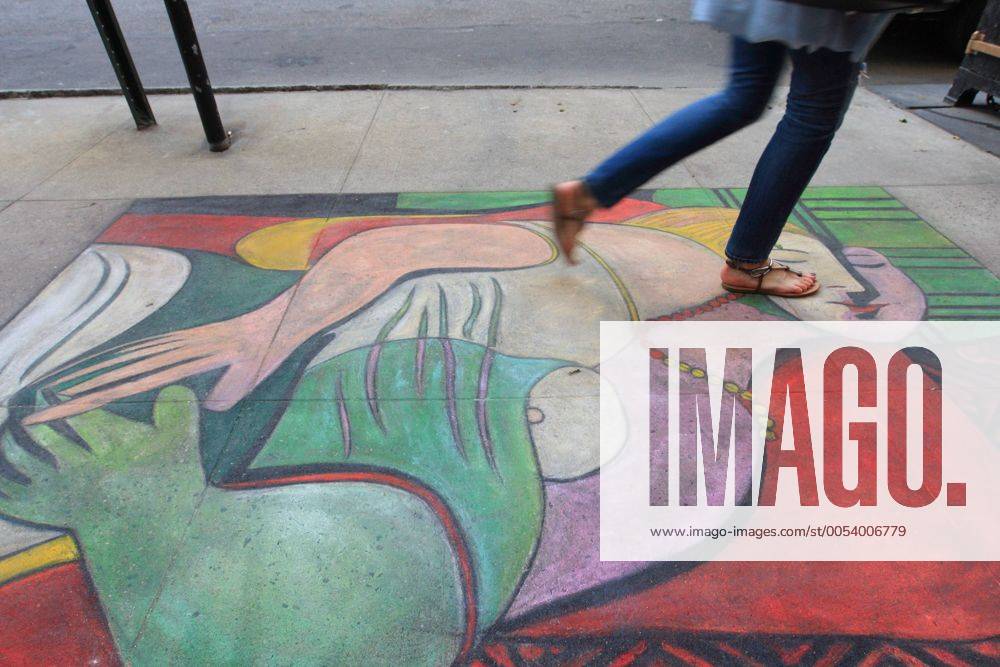(100501) -- NEW YORK, May 1, 2010 (Xinhua) -- People walk past a copy of master Pablo Picasso s The Dream on Madison Avenue, New York, the United States of America, April 30, 2010. A street artist drew The Dream on the pavement of Madison Avenue, attracting lots of people. (Xinhua Wu Kaixiang) (gj) (4)U.S.-NEW YORK-MADISON AVENUE-PICASSO