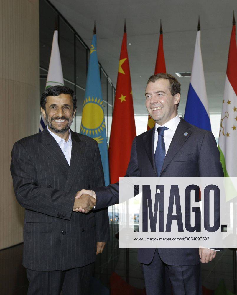 ITAR-TASS 13: YEKATERINBURG, RUSSIA. JUNE 16, 2009. President of Russia Dmitry Medvedev and President of Iran Mahmoud Ahmadinejad (L) appear prior to a narrow format summit meeting of the Shanghai Cooperation Organization (SCO) member states and SCO observer states. Highlight 1002122