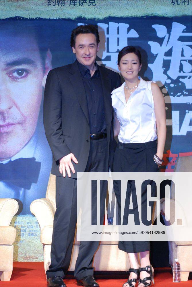 SHANGHAI, CHINA-JUNE 13:(CHINA OUT) American film actor and screenwriter John Cusack and Chinese actress Gong Li attend a press conference of film - Shanghai - during the 13th Shanghai International Film Festival on June 13, 2010 in Shanghai, China. CFP407822502