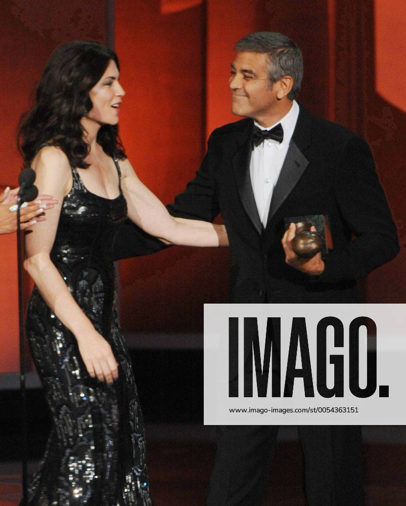 George Clooney accepts the Bob Hope Humanitarian Award from presenter Julianna Margulies , during the 62nd annual Primetime Emmy Awards at the Nokia Theatre in Los Angeles on August 29, 2010. LAP20100829615