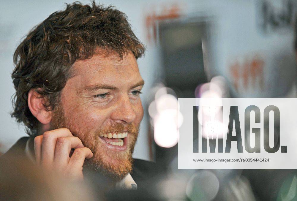Actor Sam Worthington is surrounded by TV lights as he speaks to reporters on the red carpet at the world premiere of Last Night at Roy Thomson Hall on closing night of the Toronto International Film Festival in Toronto, Canada on September 18, 2010. TOR2010091834