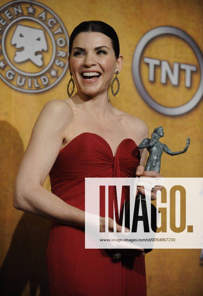 Julianna Margulies poses backstage after winning the female actor in a drama series award at the 17th annual Screen Actors Guild Awards held at the Shrine Auditorium in Los Angeles on January 30, 2011. LAP20110130157