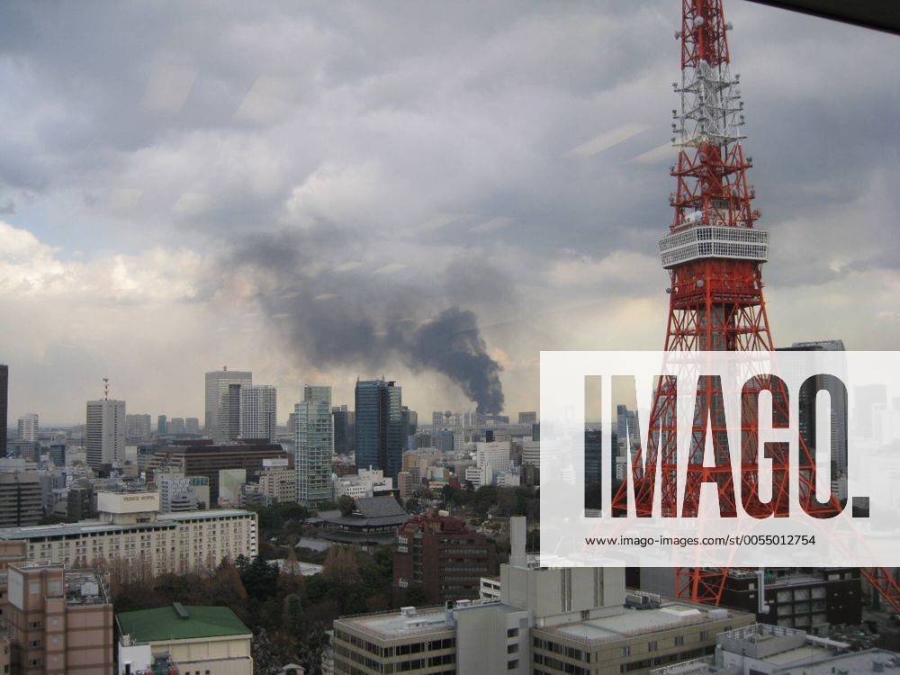 (Xinhua) -- Smoke rises after the earthquake in Tokyo, Japan, March 11, 2011. An earthquake measuring 8.6 on the Richter scale jolted off the east coast of Japan s main Honshu island Friday, according to the China Earthquake Network Center. (Xinhua Feng Wuyong) (djj) JAPAN-TOKYO-QUAKE