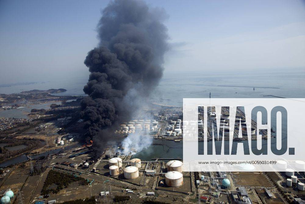 Sendai, Japan - Columns of thick black smoke reach high in the air from a burning oil refinery in Sendai, Miyagi prefecture, on Sunday, March 13, 2011, two days after a powerful earthquake with a magnitude 9.0 jolted Japan s northeastern prefectures, wreaking havoc on otherwise beautiful coastal towns and farmlands. The death toll from the nation s worst and the world s fourth worst quake could rise above 10,000. (vbhb000014)
