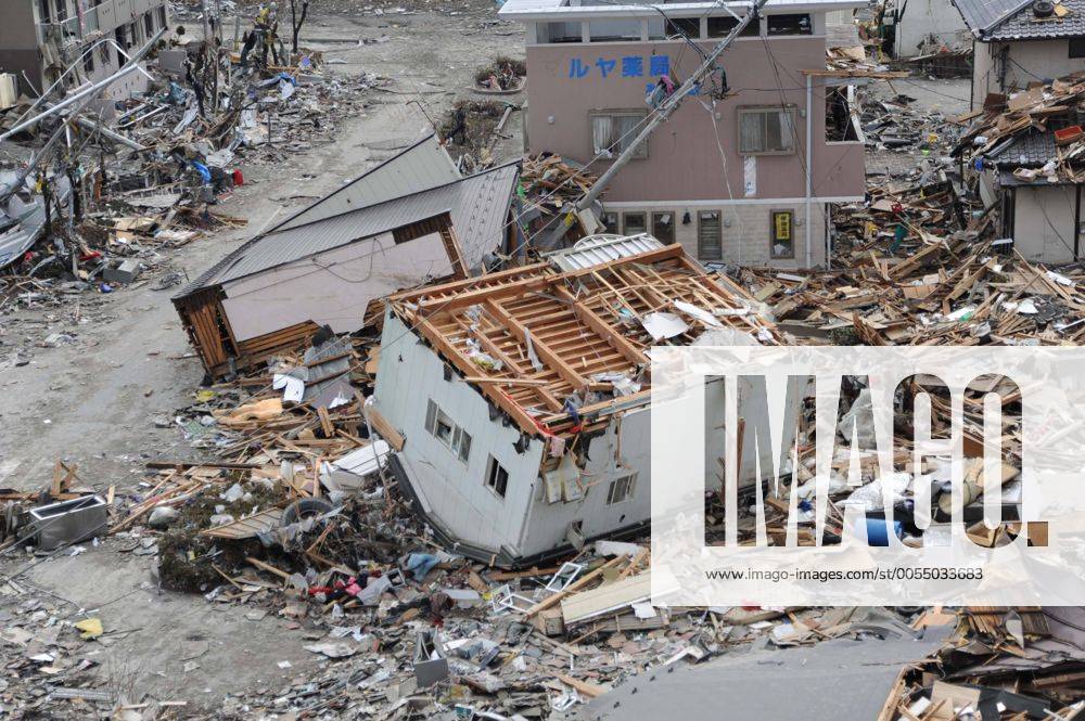 OFUNATO, Japan (March 15, 2011) An upended house is among debris in Ofunato, Japan, following a 9.0 magnitude earthquake and subsequent tsunami. ( 20114191)