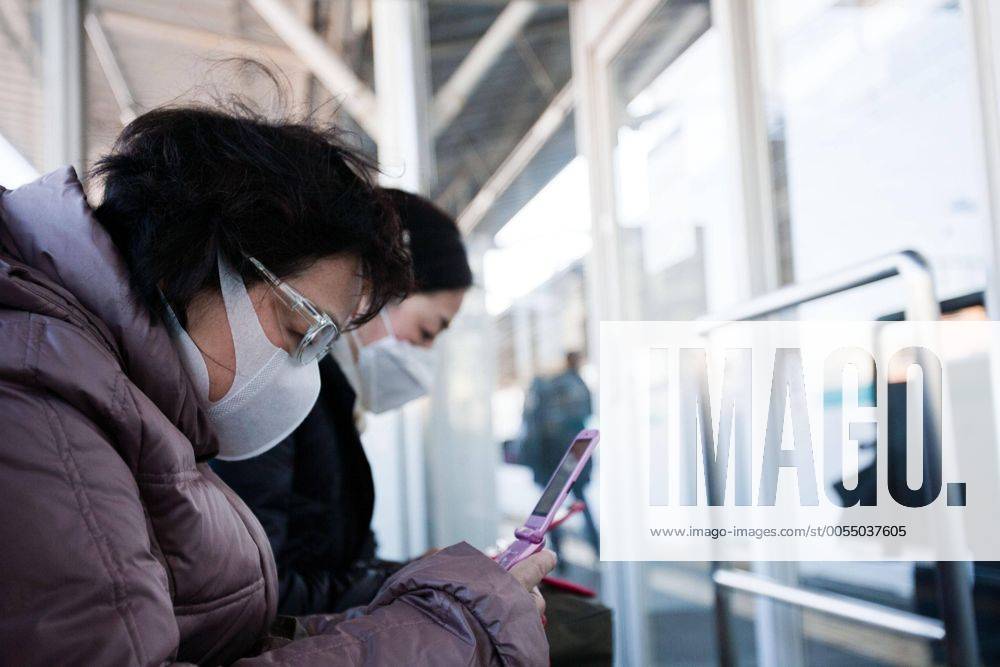 Tokyo, Japan - A Japanese commuter is seen wearing a mask and goggles to protect herself from the high radiation levels that drifted to Tokyo from the quake-hit nuclear plant in Fukushima. The radiation fears has caused many people to flee from the city to the southern regions of Japan and overseas. (xjrb000720)