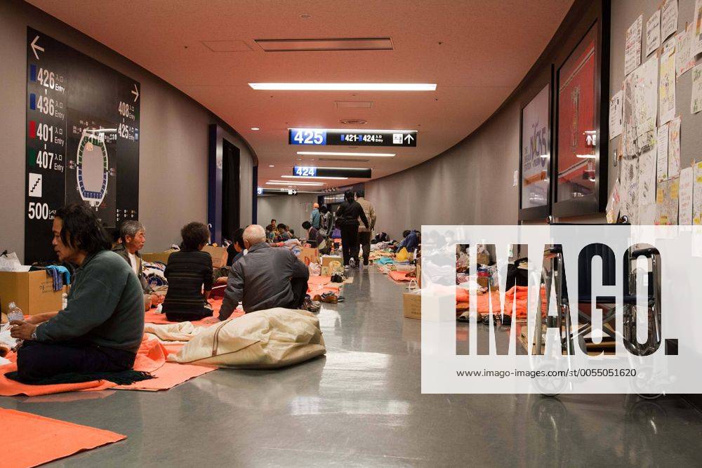 Saitama, Japan - A photo made available on March 22, 2011 shows evacuees from Fukushima along the hallways at Saitama Super Arena, a temporary shelter in Saitama, north of Tokyo. Thousands of residents from Fukushima evacuated their town as high levels of radiation continued to be a high risk from the quake-hit nuclear plant. (XJRB-EvacueesatSaitamaSuperArena011)