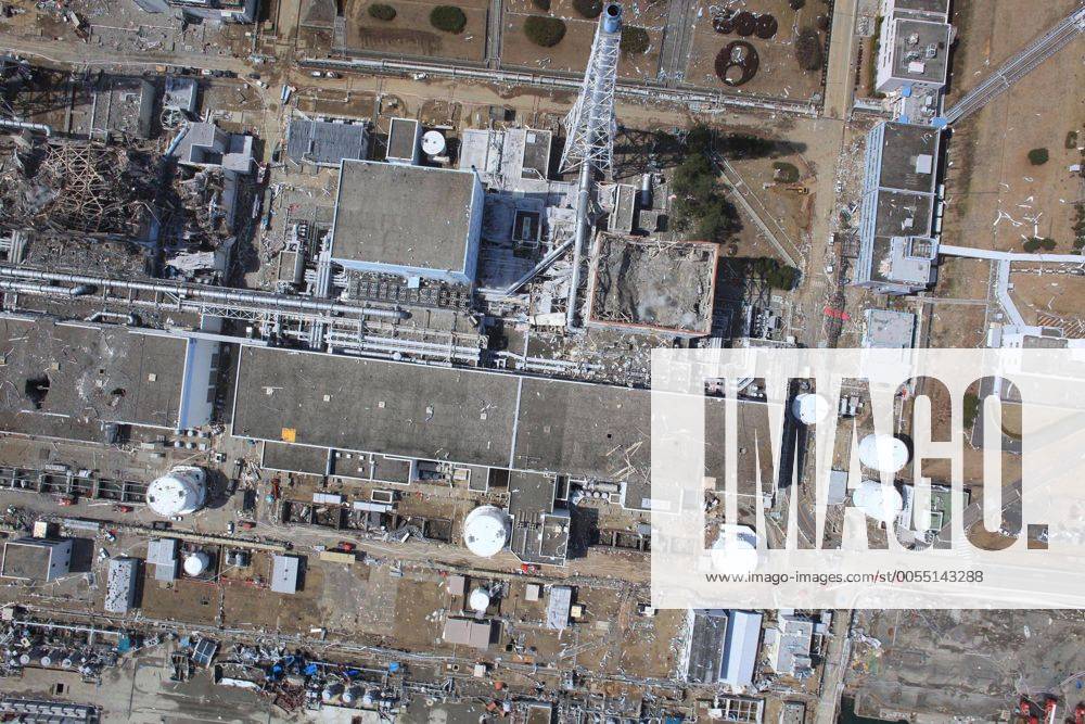 In this March 24, 2011 aerial photo taken by small unmanned drone and released by AIR PHOTO SERVICE, the crippled Fukushima Dai-ichi nuclear power plant is seen in Okumamachi, Fukushima prefecture, northern Japan. From right to left, Unit 1 through Unit 3. (pvaa012482)