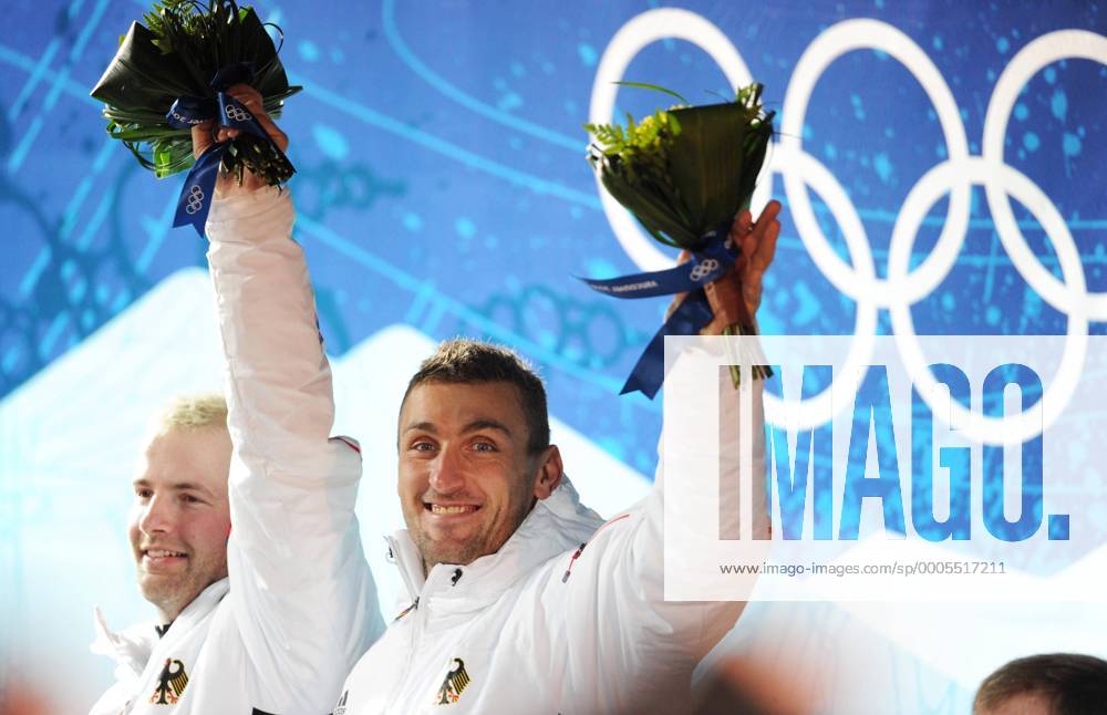 WHISTLER, Feb. 21, 2010 Andre Lange (L) Kevin Kuske of Germany react during the flower ceremony for the two-man Bobsleigh at the 2010 Winter Olympic Games in Whistler, Canada, Feb. 21, 2010. Andre Lange Kevin Kuske won the goldmedal with a total time of 3 minutes and 26.65 seconds. o0 Jubel Freude Sieg, Sieger, Olympiasieg, Olympiasieger, Ringe Olympiaringe