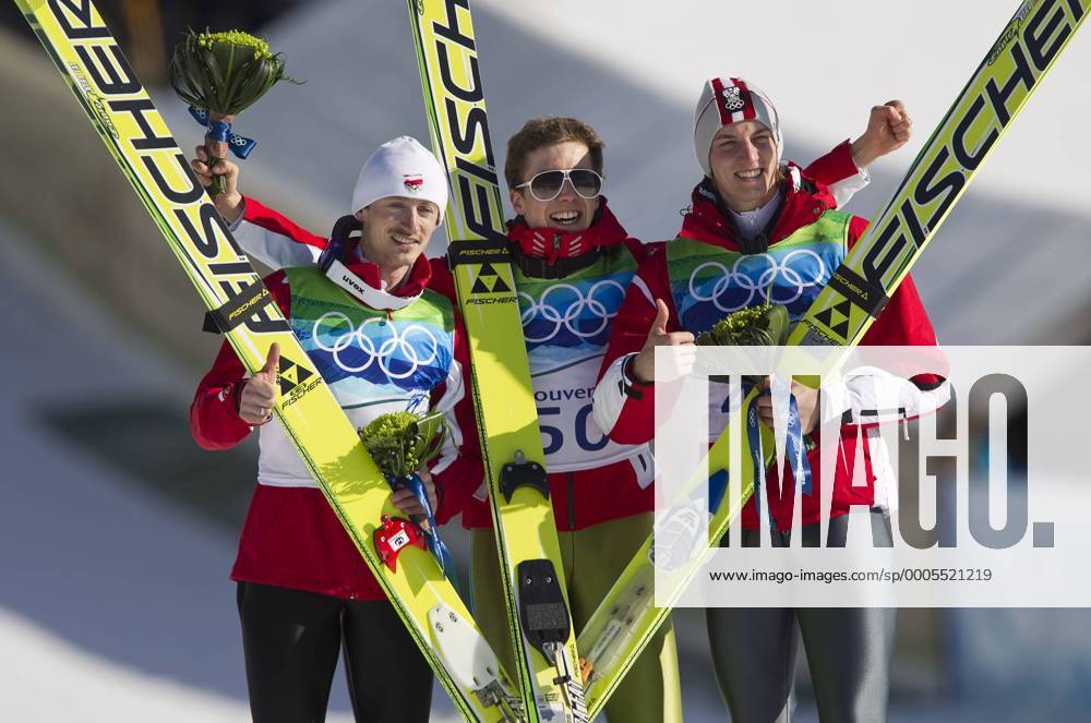(L to R) Polands Adam Malysz, Switzerland s Winner Simon Ammann and Austria s Gregor Schlierenzauer in Ski Jumping Large Hill Individual Finals during Vancouver 2010 Winter Olympics at the Whistler Olympic Park in Whistler, British Columbia, February 20, 2010. OLY20100220812 o0 Jubel Freude Sieg Olympiasieg Siegerehrung