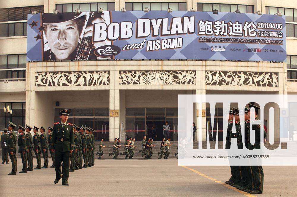 Chinese soldiers take their positions in front of Beijing s iconic Worker s Gymnasium, which will host Bob Dylan s first-ever concert in China, on April 6, 2011. Last year Chinese authorities refused to allow the legendary protest singer Bob Dylan to play concerts inside China. Chinese censors were wary of his politically charged lyrics, which inspired a generation of Americans in the 1960s and 70s to question authority in a way that is forbidden in China. Officials said the singer would have to strictly abide by an agreed playlist. PEK2011040601