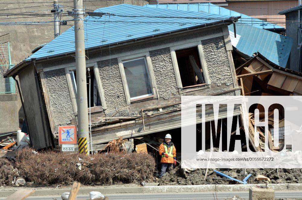 April 1st, 2011, Miyako, Japan - The upstairs of a two-story townhouse sits precariously in Miyako City, Iwate Prefecture, on April 1, 2011, three weeks after the city was devastated by a magnitude 9.0 earthquake and ensuing tsunami. (ayfa004605)