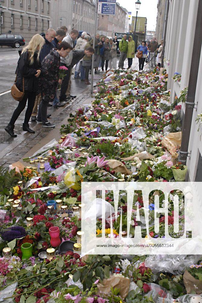 DENMARK COPENHAGEN Norwegian flag half mast at embassy and People laying flowers at doorr step Norwegian Embassy in Copenhagen Amaliegade 39 in sorrow of tragedy of 91 people been killed by gund mand bomb blast on July 22, 2011 in Norwegian captila Oslo, here in Copenhagen children,family,women and men laying flowers at door step of Norwegain Embassy today saturday 24 July 2011