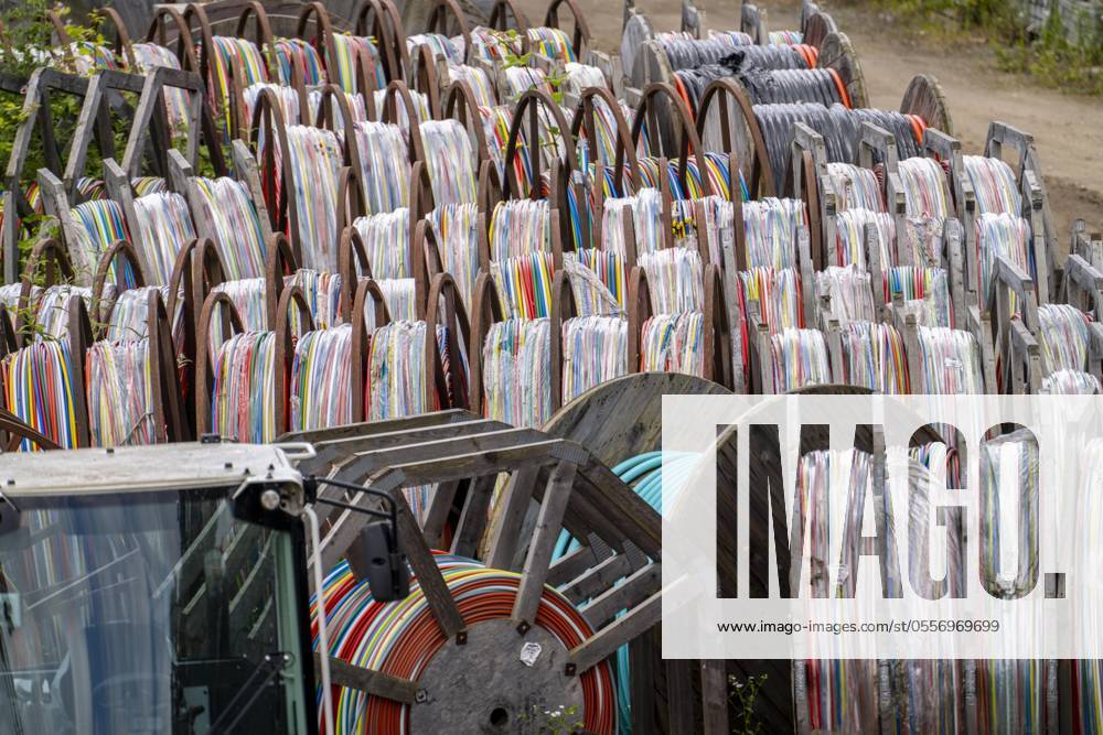 Cable drums with conduits for fiber optic cables, at a storage yard, NRW, Germany, fiber optic expansion