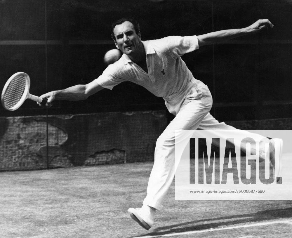 Fred Perry : 18 May 1909 - 2 February 1995 , British tennis and table tennis player and three-time Wimbledon champion , seen here playing a match at Wimbledon with British Davis Cup Team member Tony Mottram , whom Fred is coaching . 9 May 1949 Mono Print UnitedArchives1207506