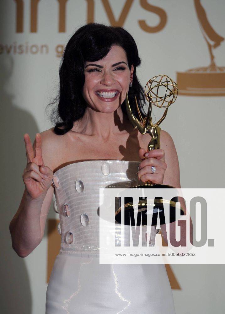 Julianna Margulies holds her Emmy Award for best actress in a drama series for ÒThe Good WifeÓ at the 63rd Primetime Emmy Awards at the Nokia Theatre in Los Angeles on September 18, 2011. LAP20110918138