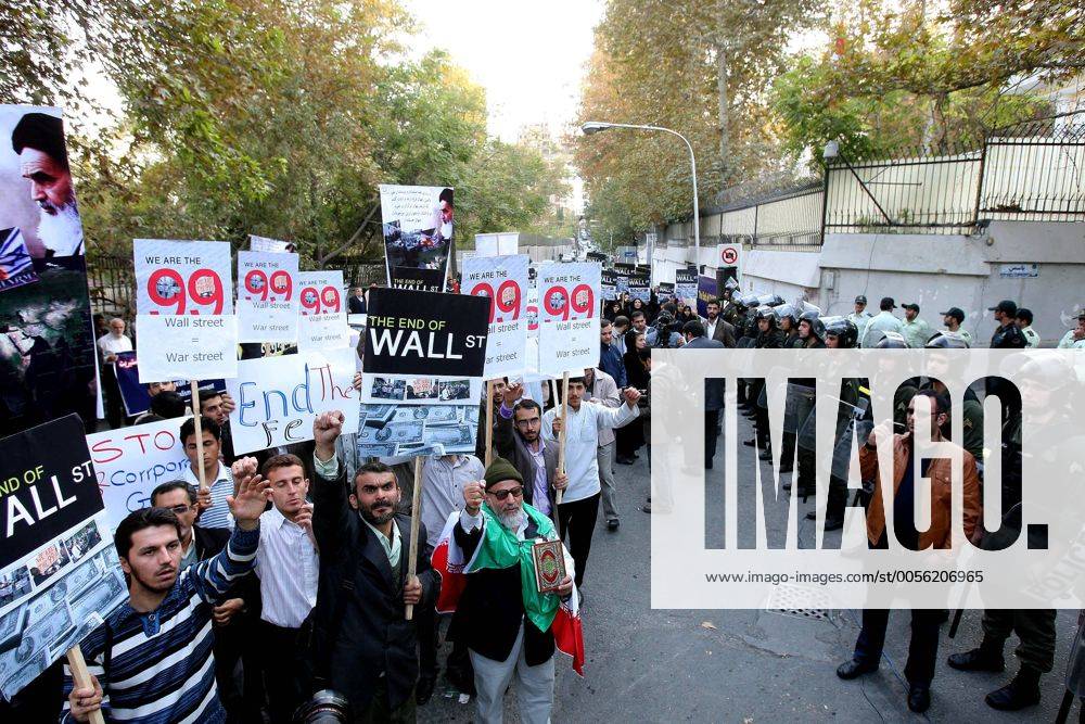 (111022) -- TEHRAN, Oct. 22, 2011 (Xinhua) -- Students take part in a gathering in support of U.S. Wall Street demonstrators outside the Swiss embassy which handles U.S. interests in Tehran, Iran, Oct. 22, 2011. (Xinhua Chavosh Homavandi) IRAN-U.S.-OCCUPY WALL STREET-SUPPORT
