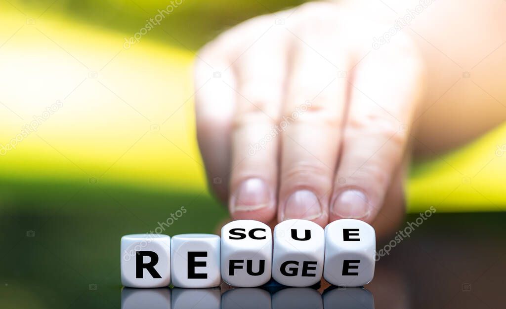 Dice form the words refugee and rescue.