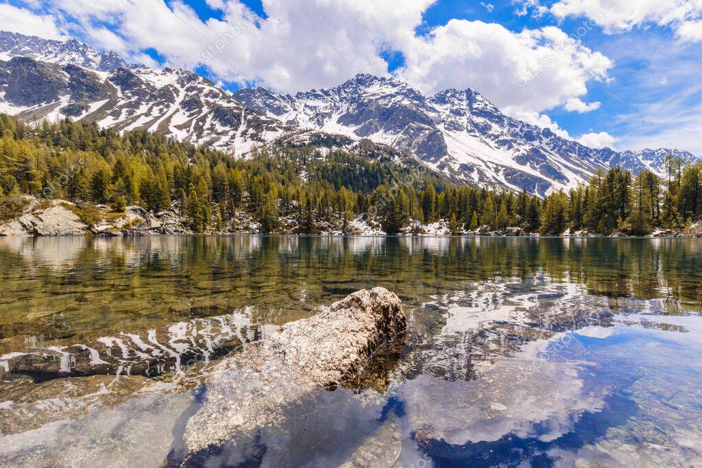 Beautiful mountain lake of Saoseo (Lagh da Saoseo) on a sunny afternoon in Val da Camp, a valley in the Poschiavo region of the Grisons, Switzerland.