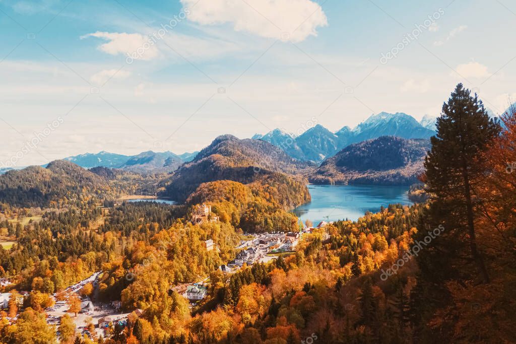 Beautiful nature of European Alps, landscape view of alpine mountains, lake and village in autumn season, travel and destination scenery