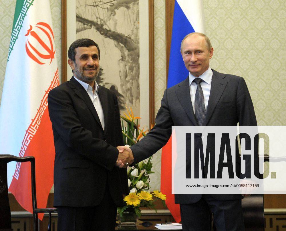 ITAR-TASS: BEIJING, CHINA. JUNE 7, 2012. Iran s President Mahmoud Ahmadinejad (L) and Russia s President Vladimir Putin shake hands during their meeting on the sidelines of the 12th Shanghai Cooperation Organization Summit (SCO) in Beijing. Highlight RE10072F