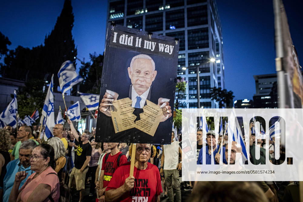 Anti Government Protest in Tel Aviv A protestor holds up a sign showing Israeli Prime Minister Benjamin Netanyahu tearing the Israeli declaration of independence during a demonstration in Tel Aviv, Saturday, June 15 2024. Tens of thousands of protesters gathered at dozens of locations across Israel on Saturday night calling to end the war in Gaza for a hostage deal and fresh elections just hours after news of eight Israeli soldiers that were killed in a blast in Rafah on Saturday morning. Photo by Eyal Warshavsky. Tel Aviv Israel