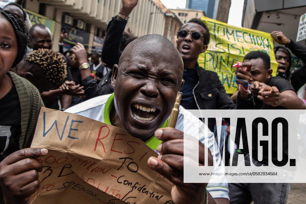 A protester gestures while showing a bullet after police fired rounds to disperse protesters during a demonstration against the Finance Bill 2024 in the streets of Nairobi. The bill proposes several new taxes, including a motor vehicle circulation tax, money transfer tax, eco levy tax, and excise duties on bread and cooking oil. The demonstration dubbed RejectTheFinanceBill2024 takes place as the bill is being tabled, with protesters urging members of parliament to reject the contentious provisions. Nairobi Kenya - ZUMAs197 20240618_aaa_s197_076