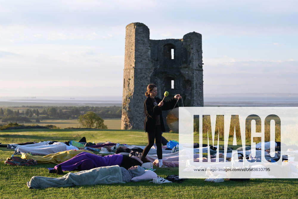 Summer Solstice Sunrise A Yoga class in the grounds of Hadleigh Castle in Essex UK greet the sunrise on the morning of the summer solstice. The sun rose at 04:40am and sets at 9:19pm on what is the longest day of the year. The official time of the summer solstice in the UK is 9:50pm on 20 June 2024. Essex Hadleigh Castle UK