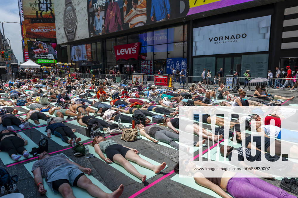22nd annual Mind over Madness Yoga on the Summer Solstice in Times Square Yoga practitioners pack Times Square in New York in the sweltering heat to practice yoga on the summer solstice, first day of summer, Thursday, June 20, 2024. The 22nd annual Solstice in Times Square, Mind Over Madness stretches the yogis ability to block out the noise and the visual clutter that surround them in the Crossroads of the World. The first day of summer has been declared the International Day of Yoga by the United Nations. ( RichardxB.xLevine