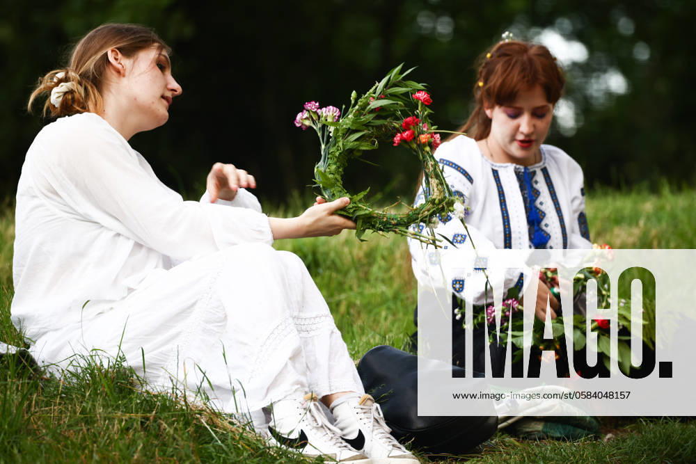 Summer Solstice Celebration In Poland Women are making flower wreaths while celebrating the summer solstice during the Kupala Night by the Krakus Mound in Krakow, Poland on June 20th, 2024. The Kupała Night is Old Slavic holiday falling on the shortest night of the year. During that night rituals were performed such as gathering and making crowns from herbs and wild flowers by girls and young women, sending garlands on water; lighting fires, dancing, singing, and jumping over fire. Krakow Poland