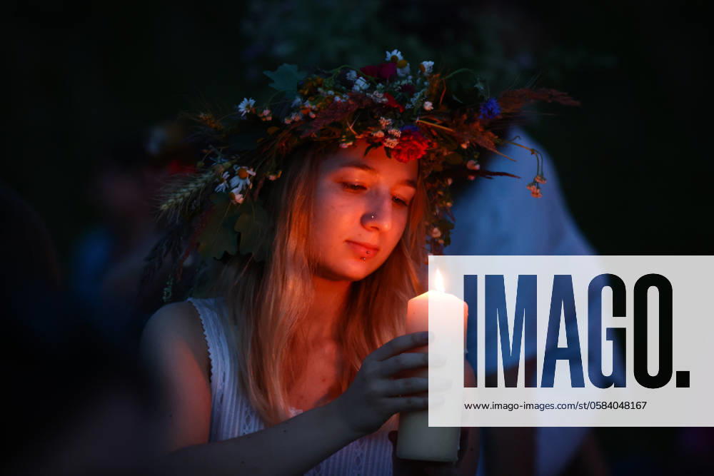 Summer Solstice Celebration In Poland A girl celebrates the summer solstice during the Kupala Night by the Krakus Mound in Krakow, Poland on June 20th, 2024. The Kupała Night is Old Slavic holiday falling on the shortest night of the year. During that night rituals were performed such as gathering and making crowns from herbs and wild flowers by girls and young women, sending garlands on water; lighting fires, dancing, singing, and jumping over fire. Krakow Poland