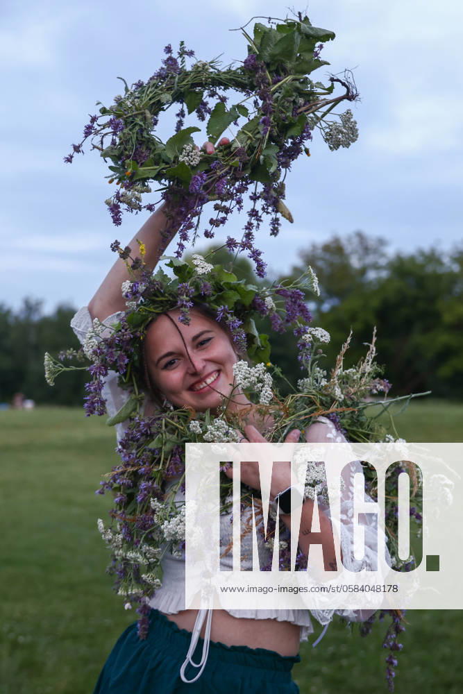 Summer Solstice Celebration In Poland A girl celebrates the summer solstice during the Kupala Night by the Krakus Mound in Krakow, Poland on June 20th, 2024. The Kupała Night is Old Slavic holiday falling on the shortest night of the year. During that night rituals were performed such as gathering and making crowns from herbs and wild flowers by girls and young women, sending garlands on water; lighting fires, dancing, singing, and jumping over fire. Krakow Poland