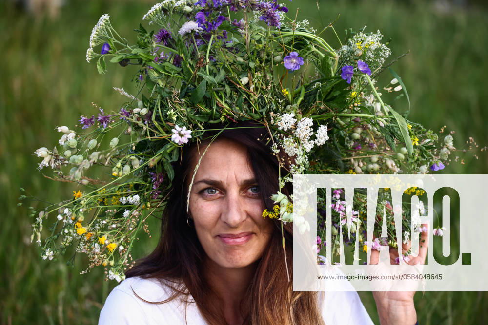 Summer Solstice Celebration In Poland A girl celebrates the summer solstice during the Kupala Night by the Krakus Mound in Krakow, Poland on June 20th, 2024. The Kupała Night is Old Slavic holiday falling on the shortest night of the year. During that night rituals were performed such as gathering and making crowns from herbs and wild flowers by girls and young women, sending garlands on water; lighting fires, dancing, singing, and jumping over fire. Krakow Poland