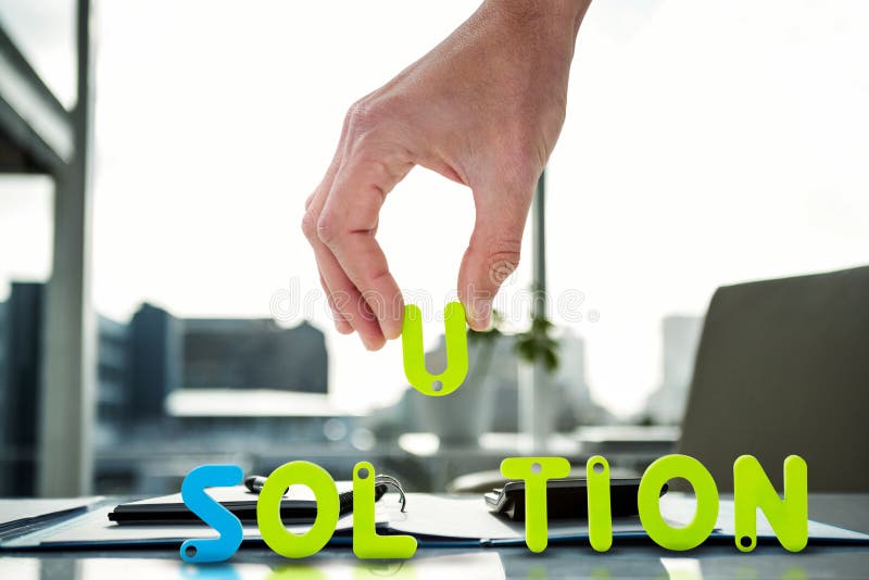 Composite image of cropped image of businessman arranging solution word, Cropped image of businessman arranging solution word against documents are posing on the desk