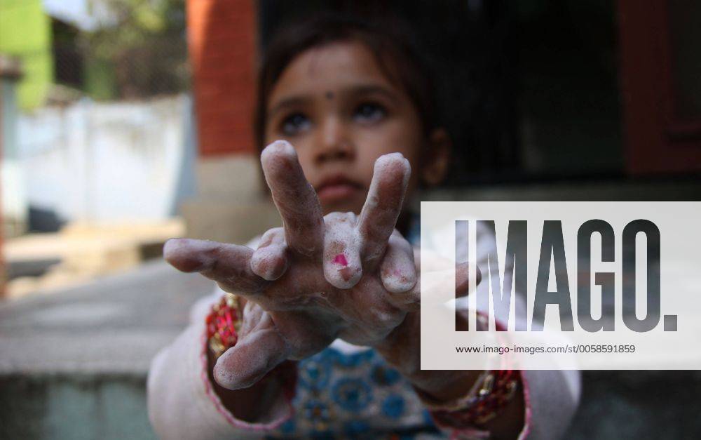 (121015) -- KATHMANDU, Oct. 15, 2012 (Xinhua) -- A girl washes her hands to mark the Global Handwashing Day in Kathmandu, Nepal, Oct. 15, 2012. Various events were organized in the country on Monday to celebrate the day. (Xinhua Sunil Sharma) NEPAL-KATHMANDU-GLOBAL HANDWASHING DAY